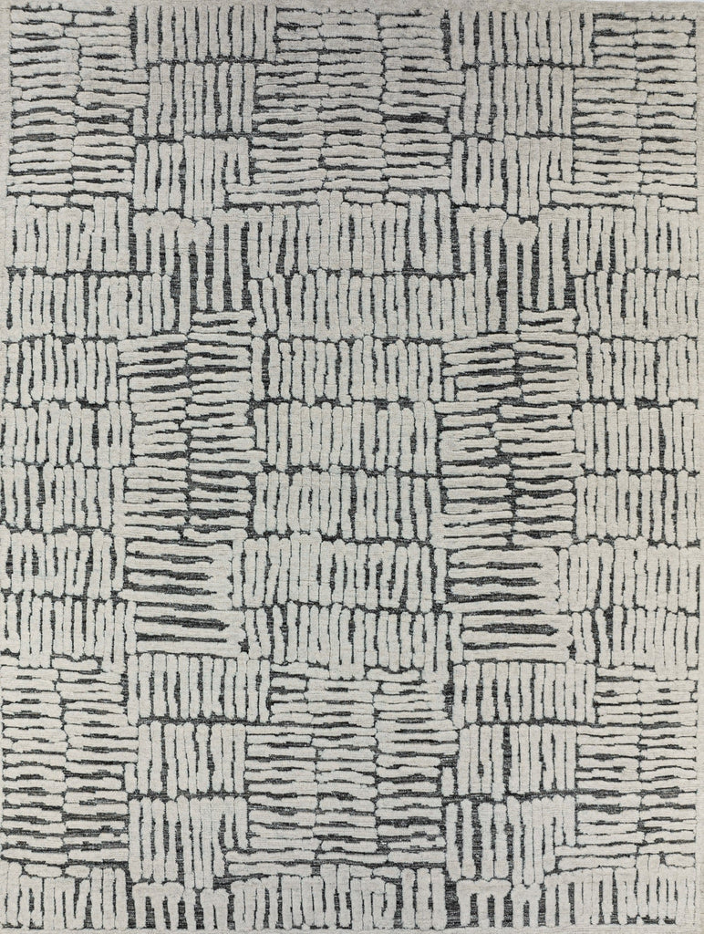 Sahara collection handmade geometric pattern wool area rug with texture and ivory, dark brown, and black colors.