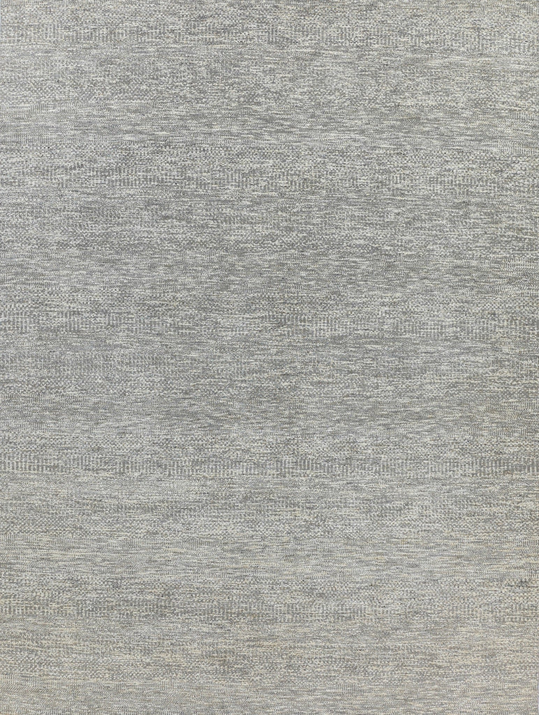 small print, solid, sisal lookalike hand knotted wool and viscose rug with a neutral beige, grey, and ivory/white color.