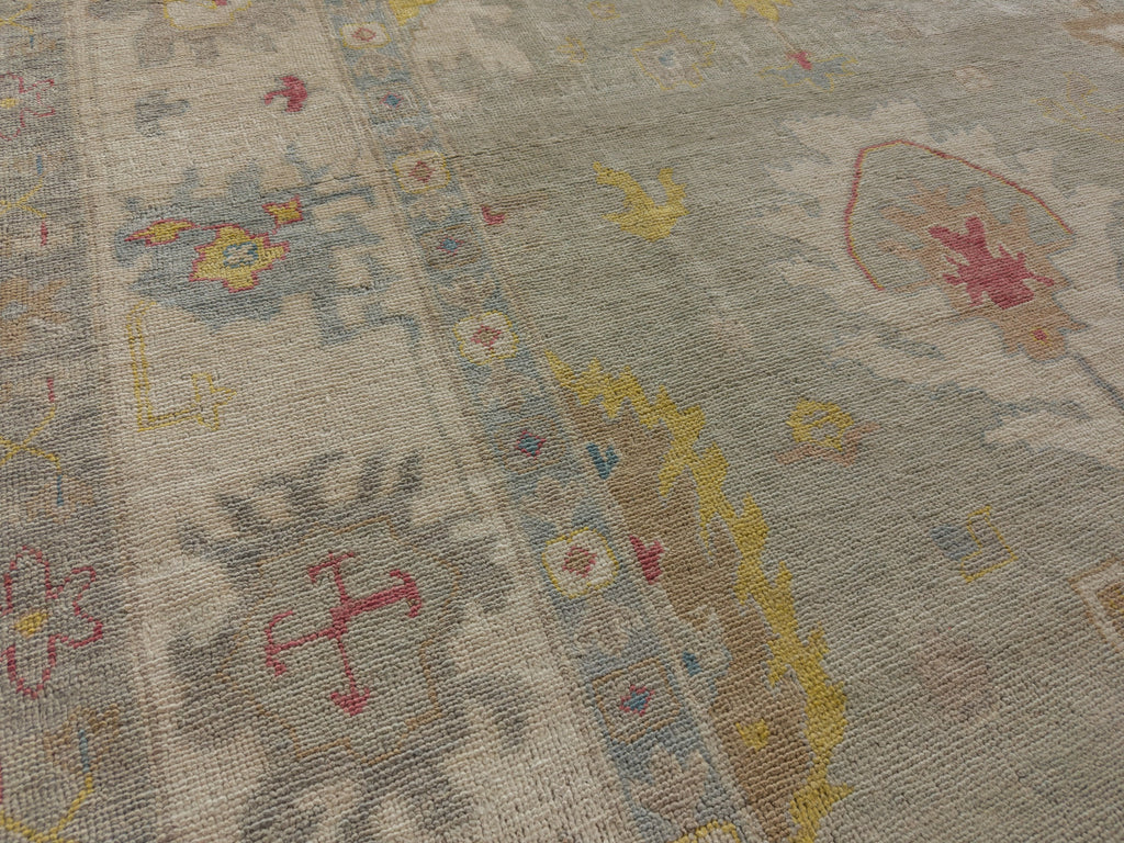 Bright gold rug with grey, light blue, red and green 10.6x14.