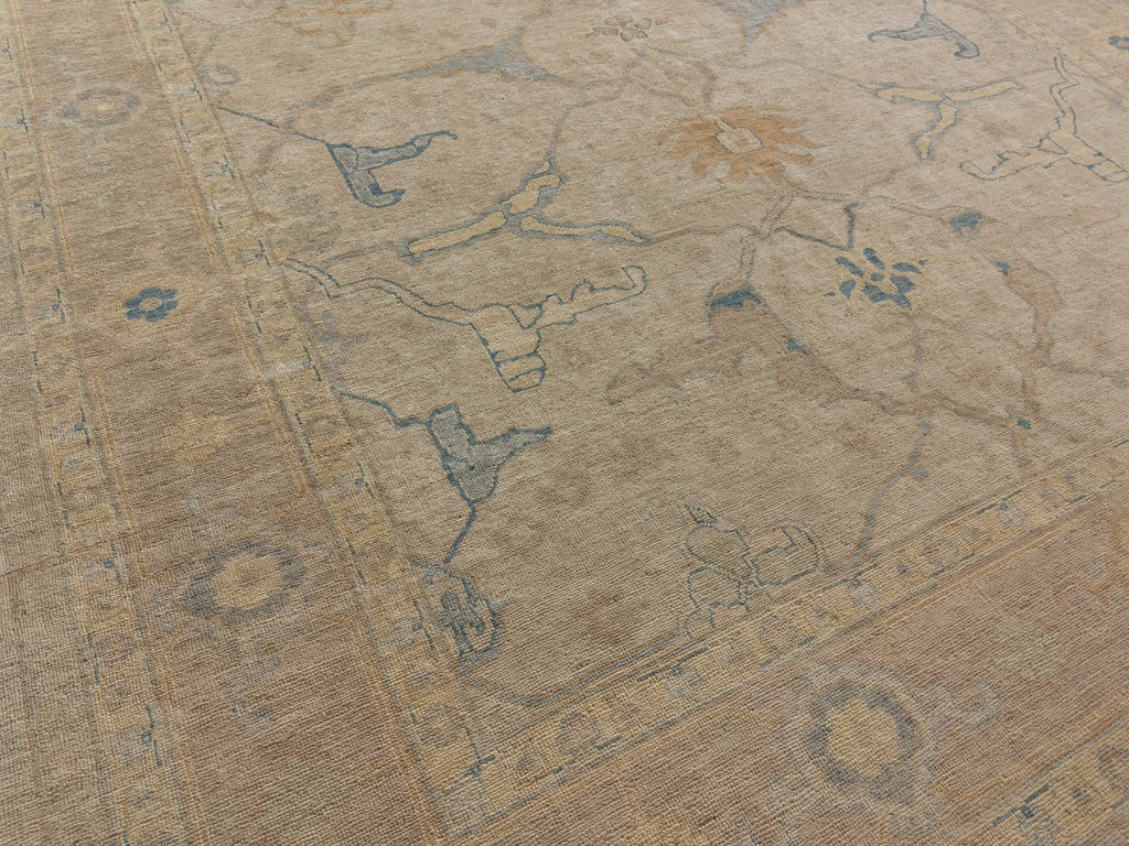 Hand knotted large floral oushak wool rug with blue, lilac, beige grey and caramel butterscotch.