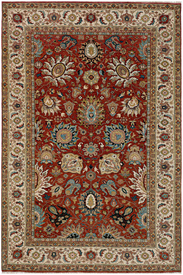 6x9 hand-knotted Persian floral wool rug with red background, ivory border, and blue accents.