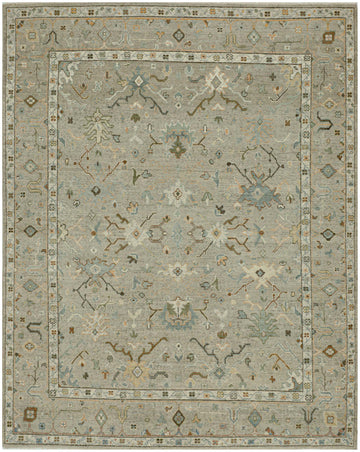 8' x 10' Tan Turkish oushak wool rug with floral and geometric design in green, blue, ivory, and cantaloupe tones.