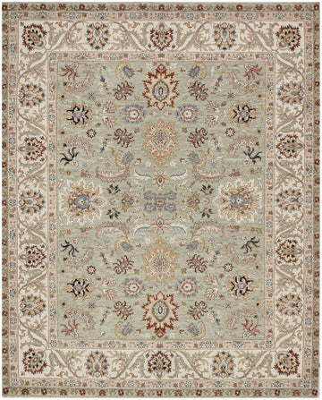 8x10 hand knotted wool rug with celadon green background, ivory border, and Persian floral motifs in red, blue, gold, rose, blush, and black.