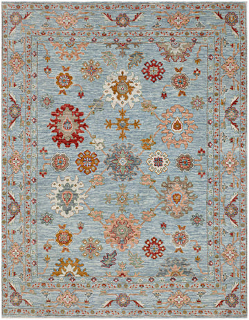 8x10 Turkish Oushak wool rug with aqua blue base, large floral pattern, and accents in red, gold, salmon pink, green, ivory, and brown.