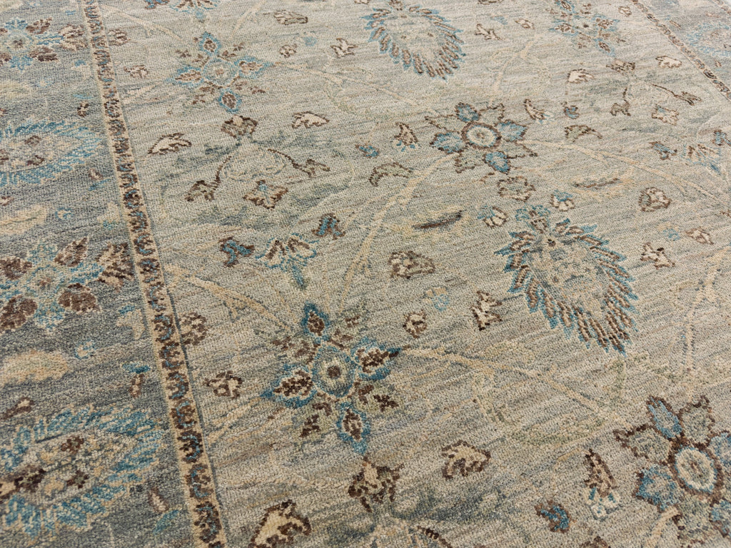 Floral bright blue accent rug with light grey, beige, and sage.