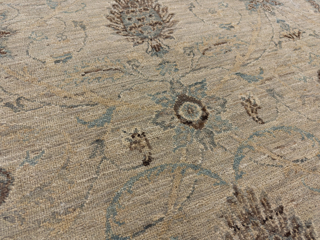 Accent blue floral rug with warm grey, brown and beige.