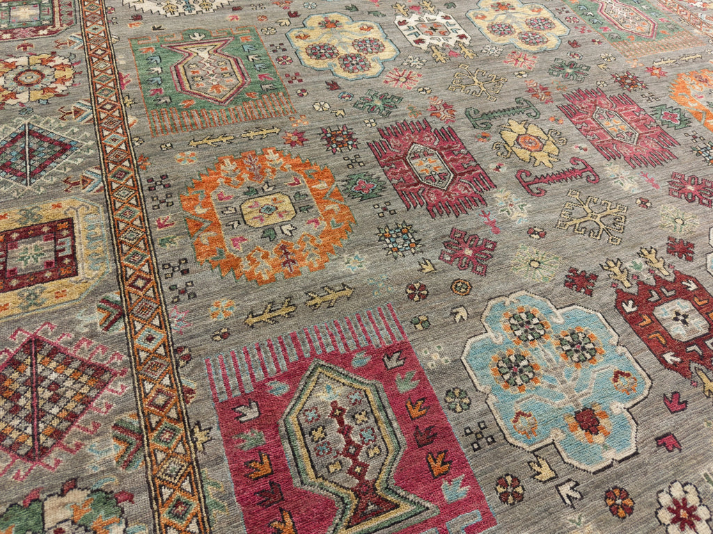 8x10 hand knotted geometric hand knotted southwest colorful rug with orange, grey and multi colors.