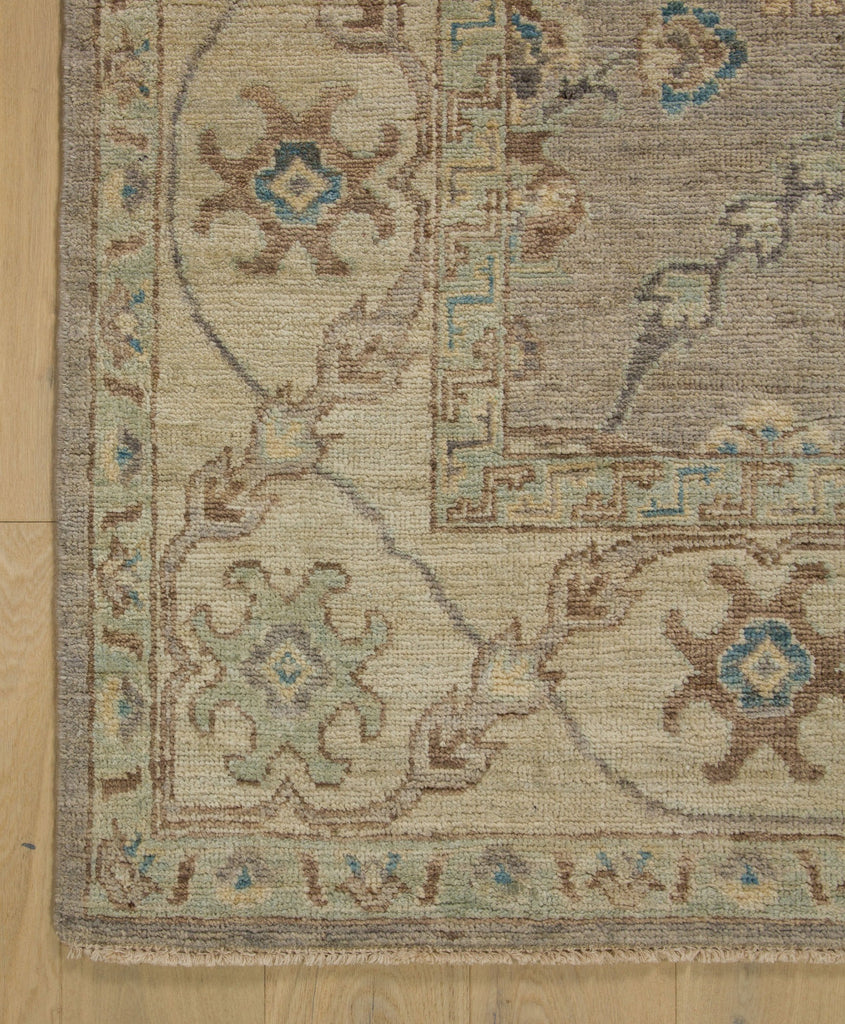 8x10 neutral modern oushak rug in pewter, blue, brown, grey and light green accents and floral oriental design.