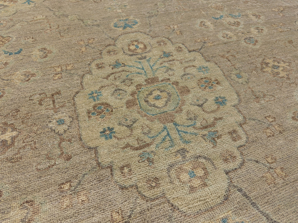 Hand knotted wool 8x10 light green medallion rug made of wool with brown, blue and pewter colors.