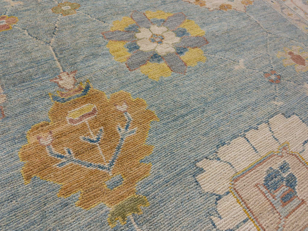 Traditional bright yellow rug with saffron, coral red, ivory and light blue.