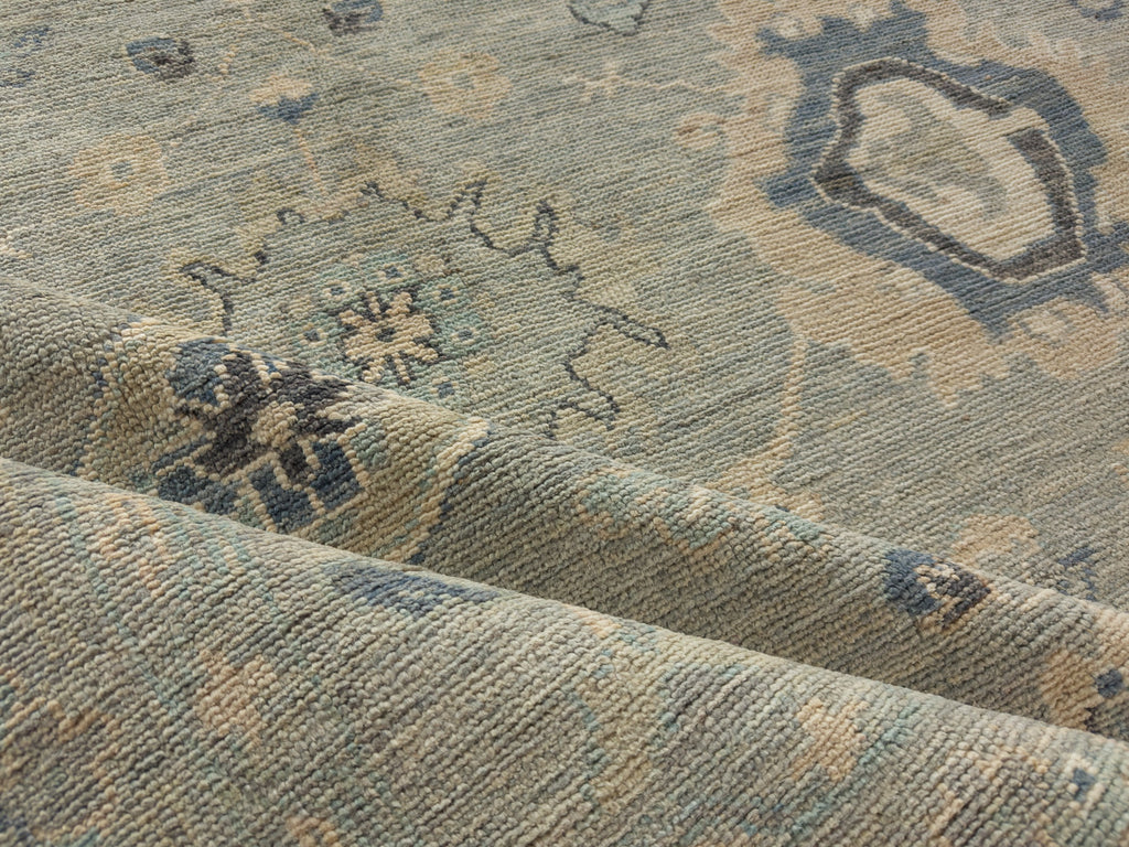 Mint grey Oushak rug 8x10 made of wool with indigo blue and beige.