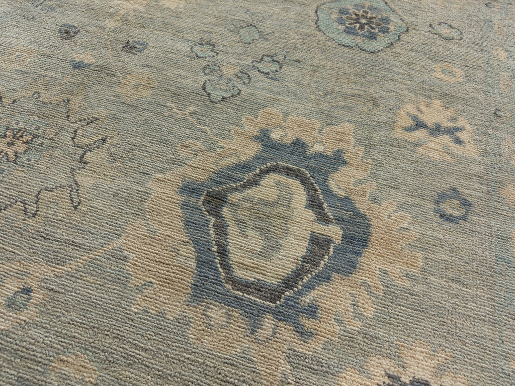 8x10 hand knotted mint grey oriental wool rug with indigo, beige and flowers.