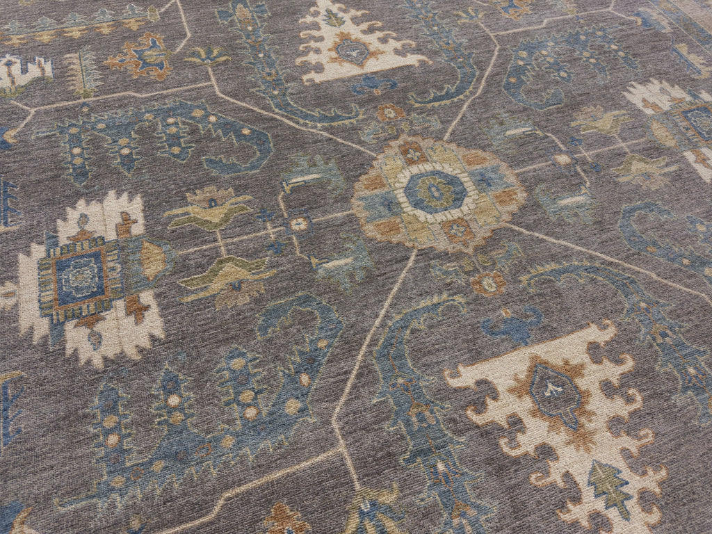 New dark grey tribal hand knotted rug with sage green, burnt orange and ivory.