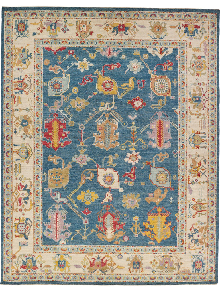 Roya Rugs 10x12 hand-knotted navy blue Turkish Oushak wool area rug with vibrant colors.
