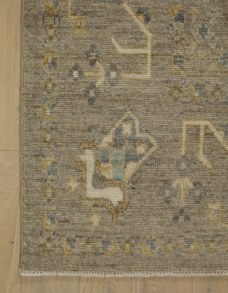 9x12 hand knotted neutral Turkish Oushak wool area rug in warm oat and moss.