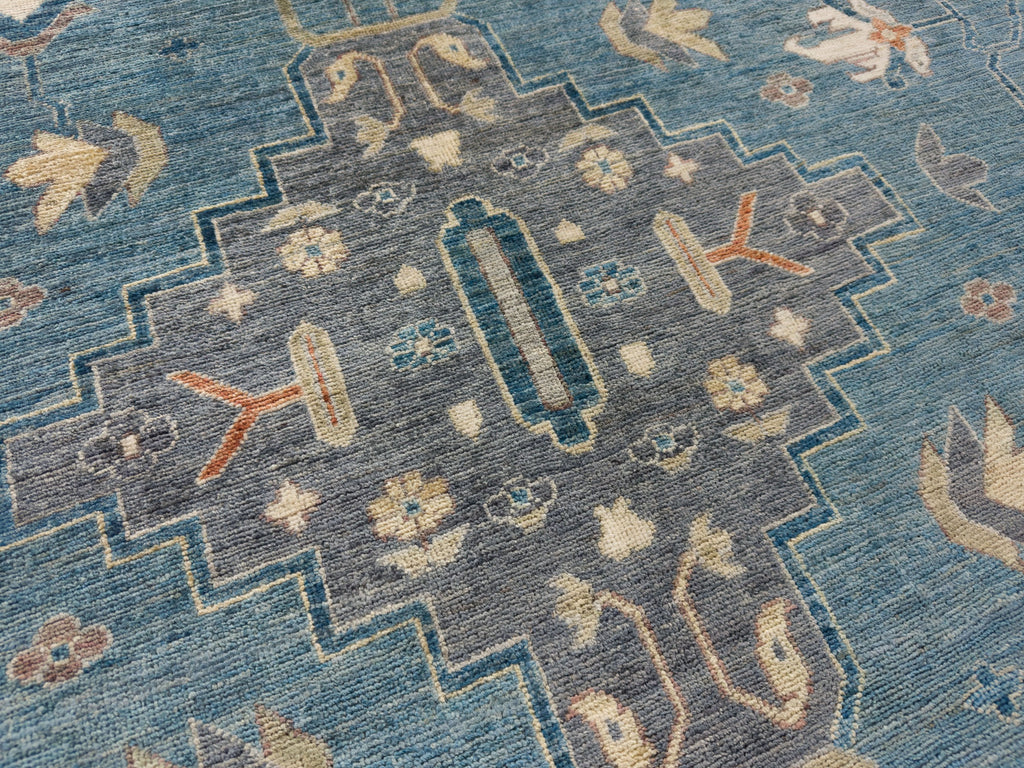 9 x 12 hand knotted grey and blue tribal area rug.