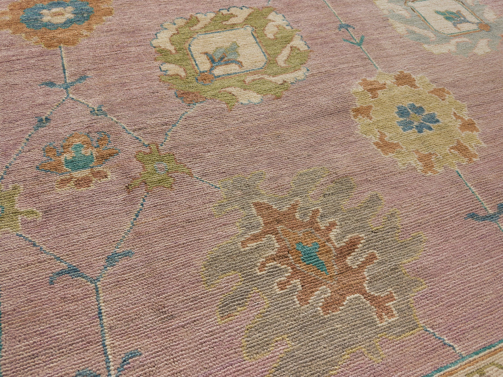 9x12 hand knotted colorful oushak rug in wool with bright green, citron, light gold, grey and leather brown.