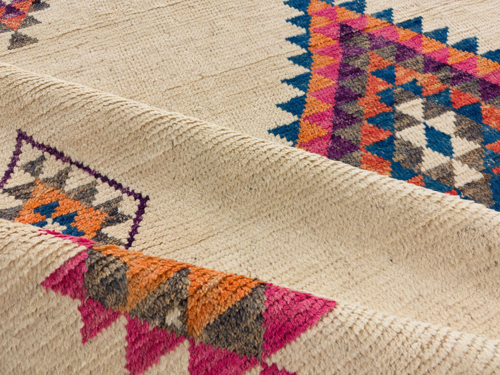 Handmade aztec shag rug 9x12 in wool in pink, blue, grey, brown and orange.