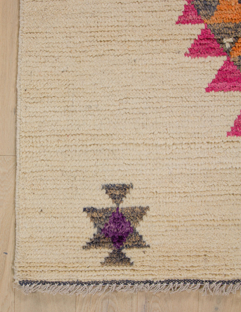 9x12 hand knotted southwest rug in large geometric design with bright pink and purple.