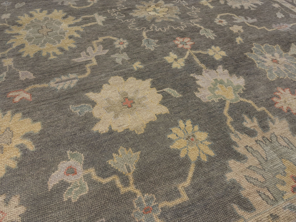 Hand knotted floral oriental blue grey Persian rug with yellow and green accents.