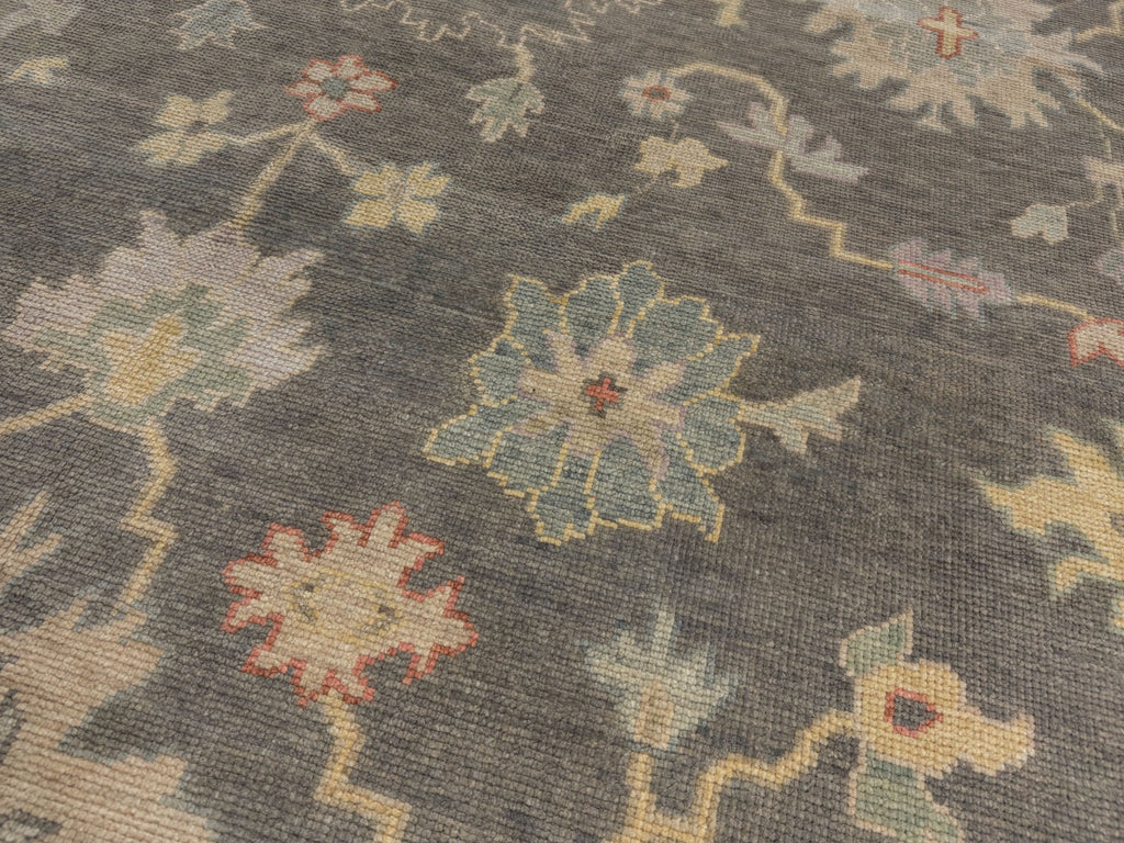 Coral traditional rug with grey green blue beige and yellow.