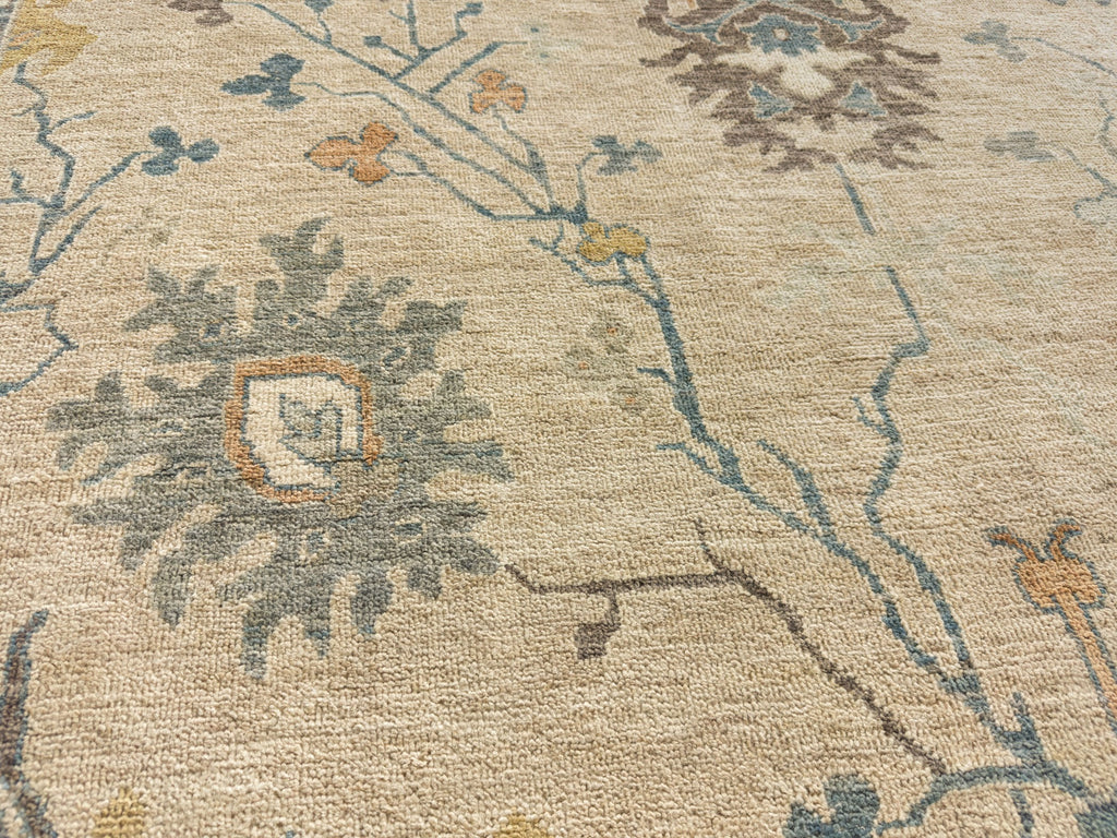 Earth tone oriental rug with grey, denim blue, gold, orange and brown accents in wool 8x10.