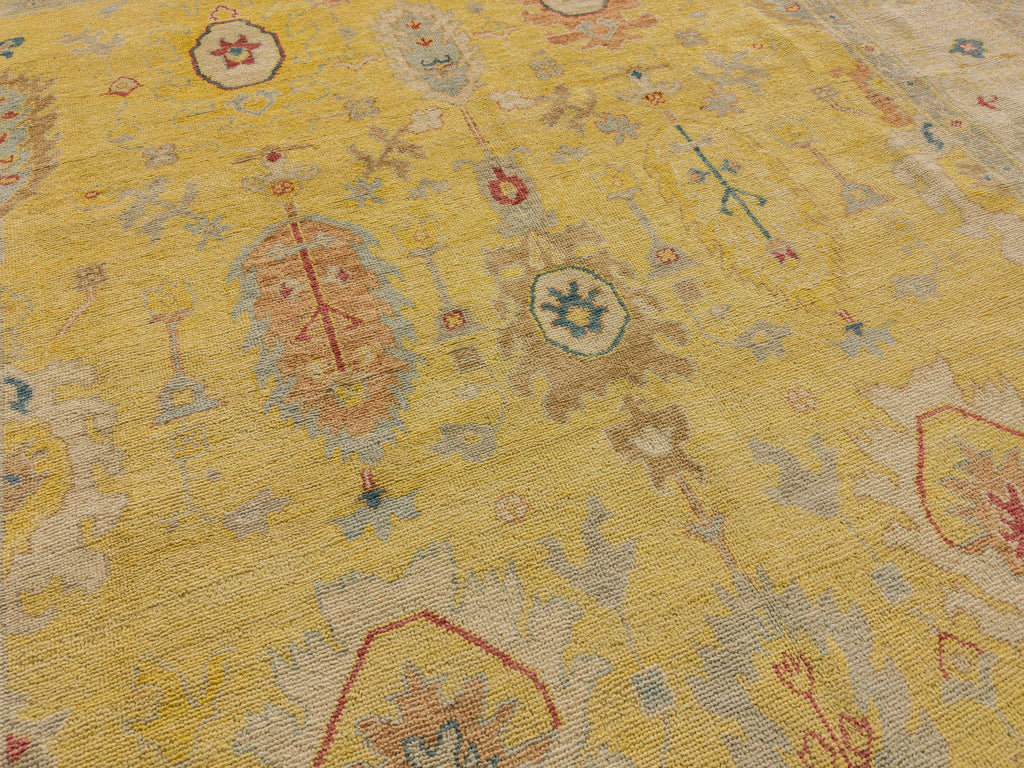New colorful Turkish wool rug with bright yellow, clay orange, teal, coral red, neutral beige and brown accents.