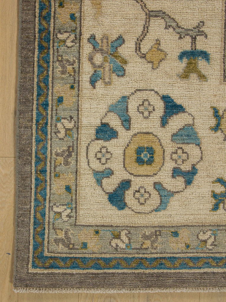 Grey Oushak rug hand knotted of wool with light gold, citron moss green, aqua blue, ivory and neutral beige accent colors.