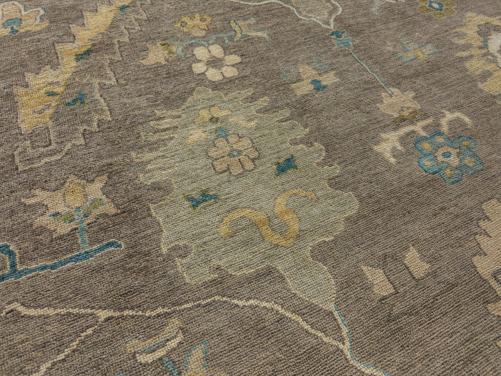 Mist rug 9x12 with modern Oushak design in silver grey, light gold, citron, blue and ivory and made of wool.