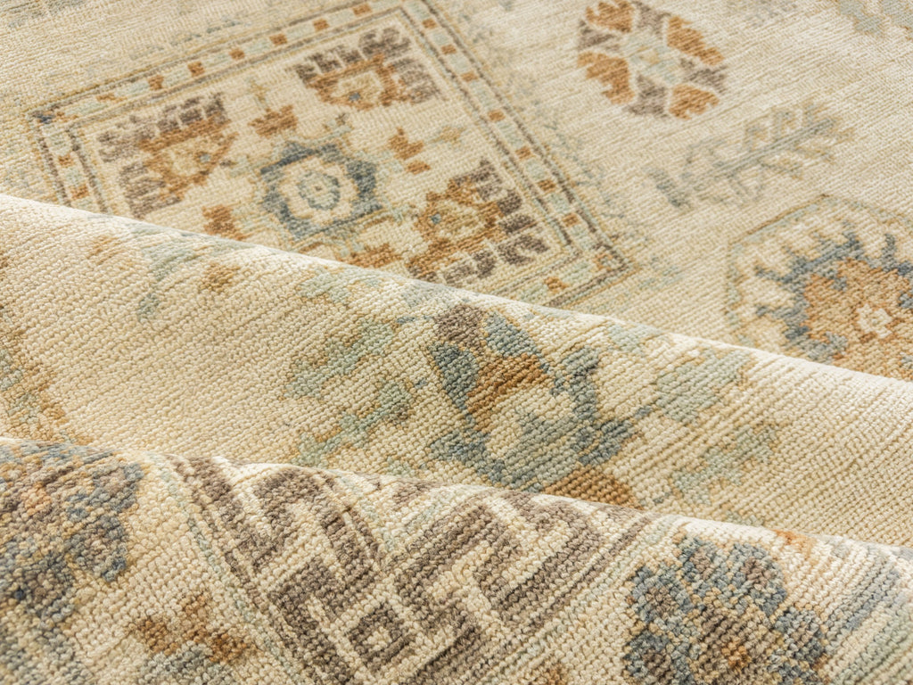 Hand knotted neutral oriental rug with light blue green, brown, and denim blue 8x10.