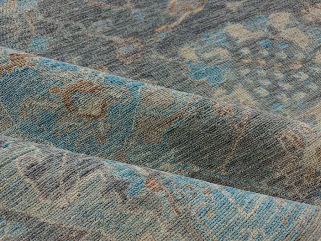 Modern grey oushak rug with slate indigo, azure blue and brown linen accents.