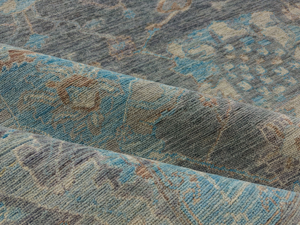 Modern grey oushak rug with slate indigo, azure blue and brown linen accents.