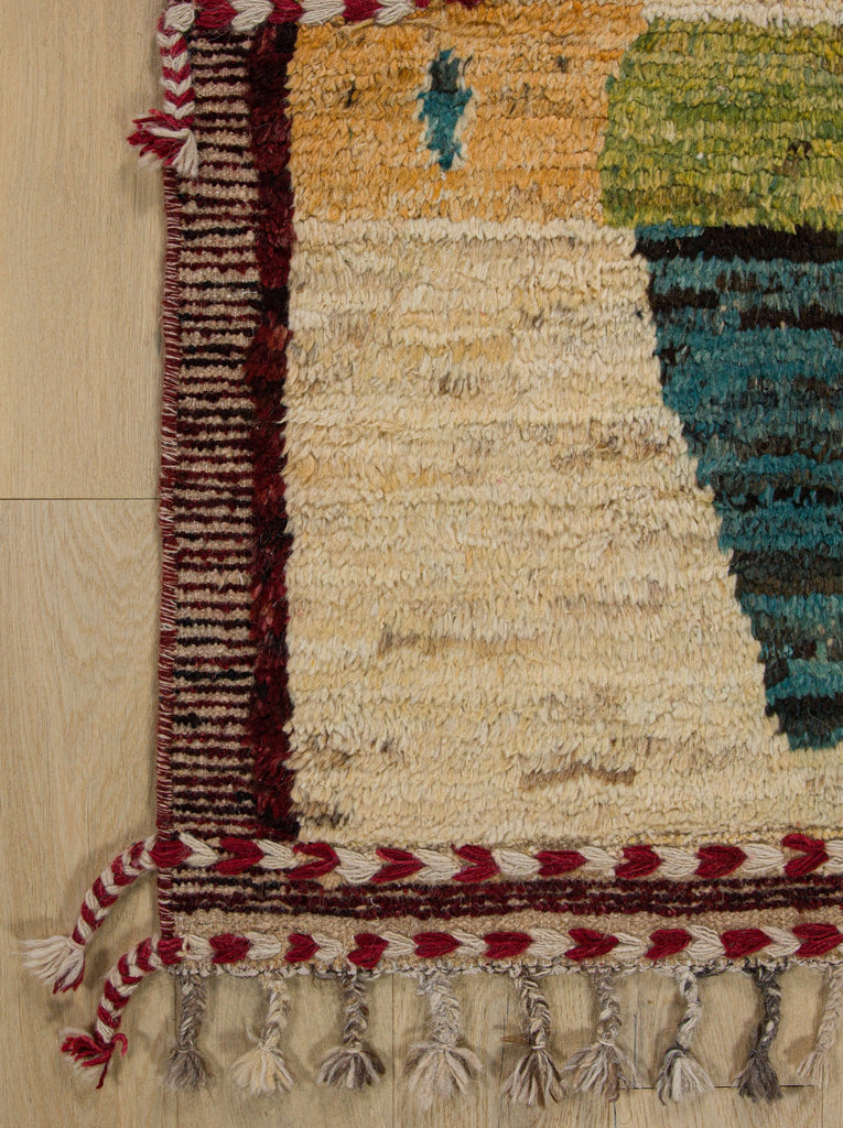 Hand knotted 6x8 colorful wool shag rug in a bohemian design with dark red, teal, lemon lime green, orange and beige.