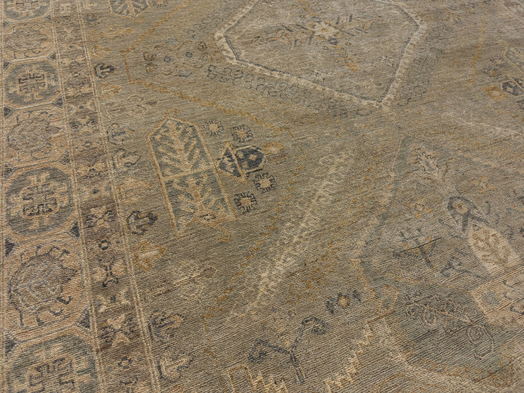 6x9 light green hand knotted wool rug with medallion design in light green, slate, beige and gold.