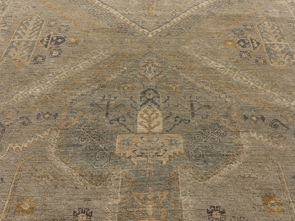 center medallion rug 6x9 hand knotted wool in light green, slate blue, dirty gold, beige, ivory and brown accents.