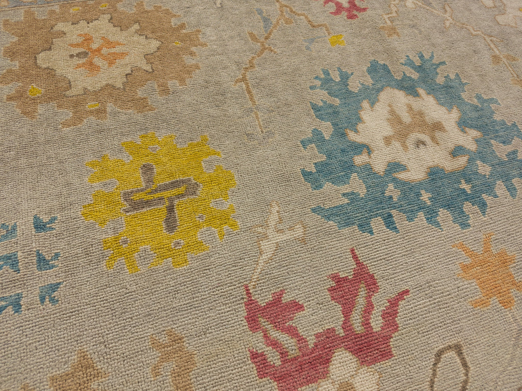 Roya Rugs hand knotted bright gold traditional wool area rug with brown, orange, beige and blue accents.