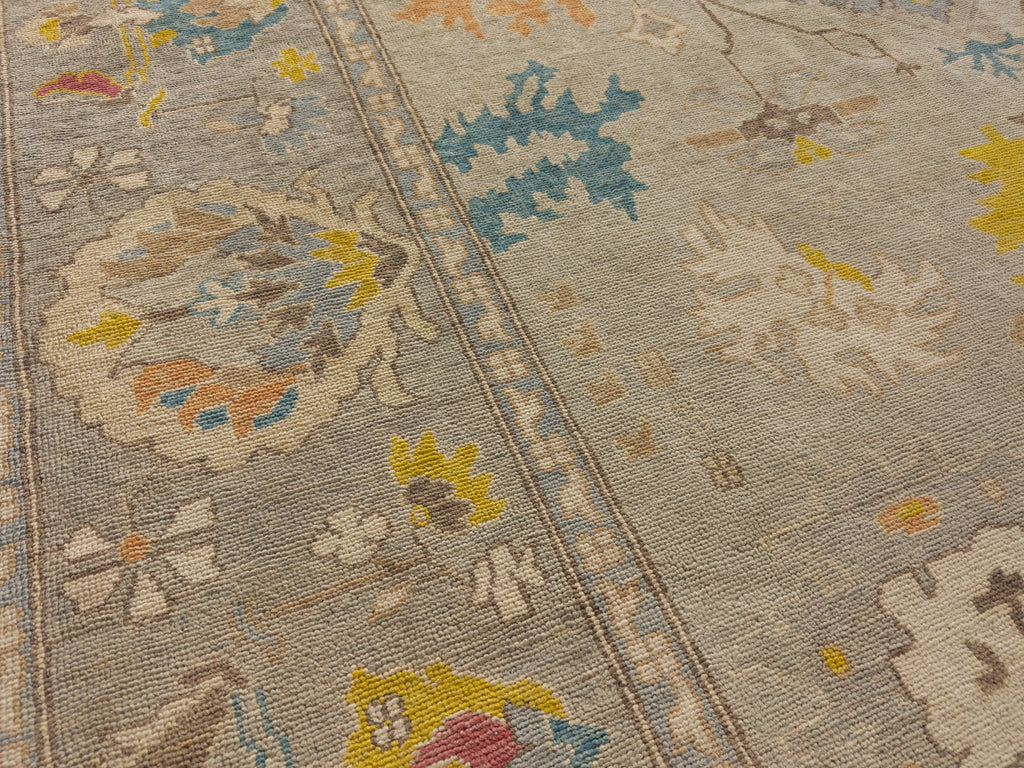 Momeni hand knotted traditional area rug by Roya Rugs one of a kind carpet with blue, indigo, orange brown and grey.