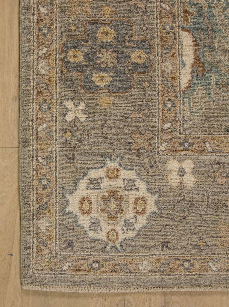 6x9 hand knotted wool neutral oushak rug in light grey, teal, blue grey, brown and ivory colors.