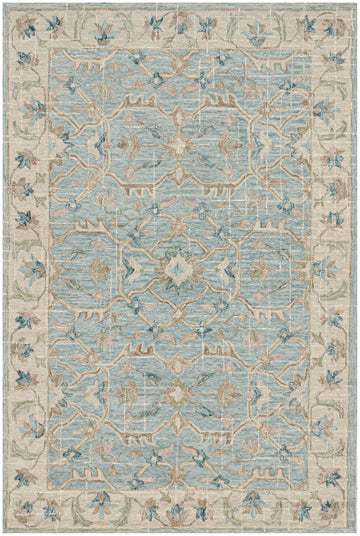 Hand-tufted blue wool area rug with modern floral design and beige, green, blush, and neutral accents.