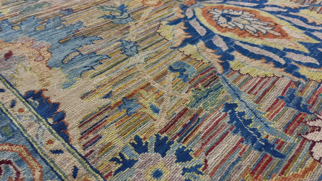 9x12 hand knotted transitional rug with ombre and whimsical colors.