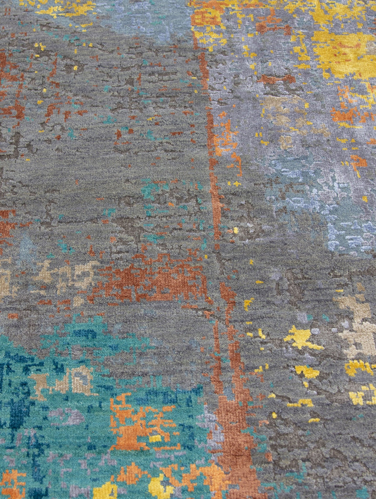 8' x 10' hand knotted dark modern rug with bold and color bright yellow, teal, orange, copper, beige, periwinkle and light baby blue colors.