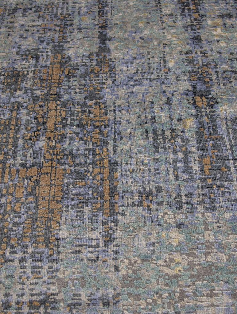 modern abstract 8x10 rug with bamboo silk and wool pile with texture, depth and accent colors saddle brown, jade green, indigo, beige, and grey.