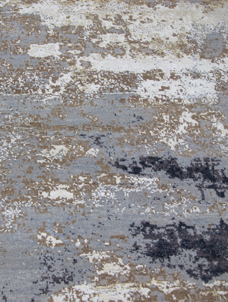 Wool and silk 9' x 12' contemporary white/black rug hand knotted with abstract design and accent grey, brown, brass and beige colors.