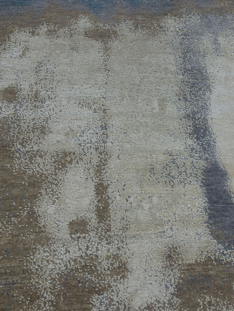 neutral 9x12 abstract wool & silk rug hand knotted and carved by hand for texture pile with earth tone colors such as ivory, white, grey and blue.