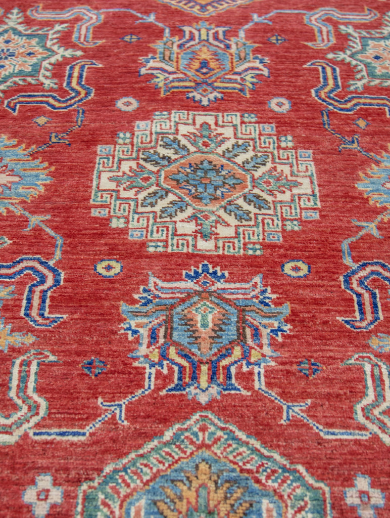 hand knotted red and ivory color 8 x 10 traditional oriental wool rug with geometric design and accent jade green, ivory, yellow/gold, blue color.