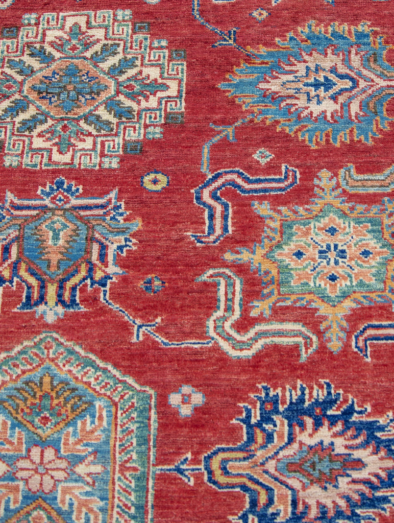 hand knotted red and ivory color 8 x 10 traditional oriental wool rug with geometric design and accent jade green, ivory, yellow/gold, blue color.