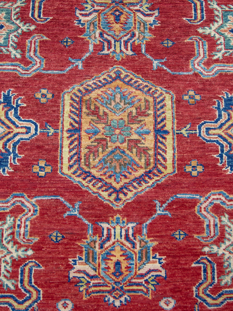 hand knotted red and ivory color 8 x 10 traditional oriental wool rug with geometric design and accent jade green, ivory, yellow/gold, blue color.