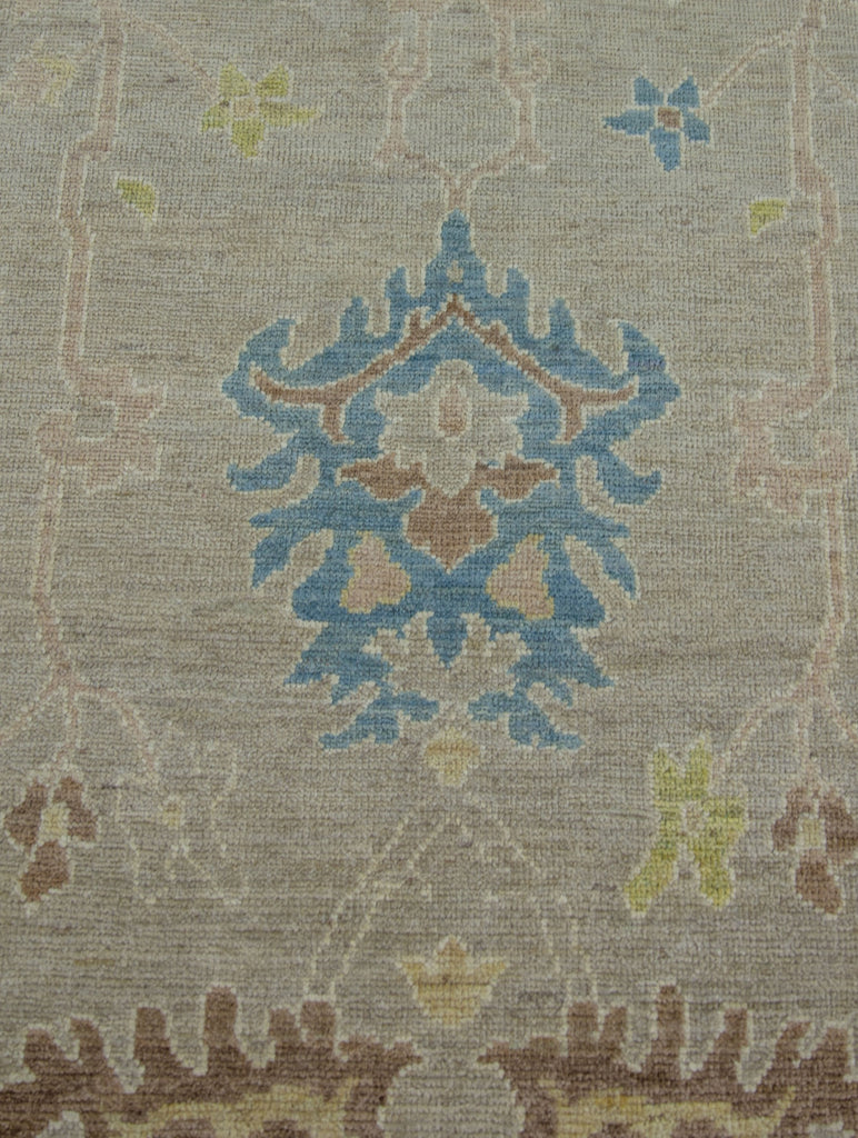 Luxury modern Turkish Oushak 9x12 wool rug in oriental design with beige/ivory and accent blue, ivory, blush, brown and citron colors.