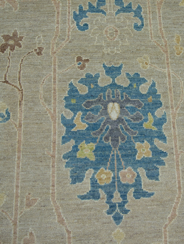 Luxury modern Turkish Oushak 9x12 wool rug in oriental design with beige/ivory and accent blue, ivory, blush, brown and citron colors.