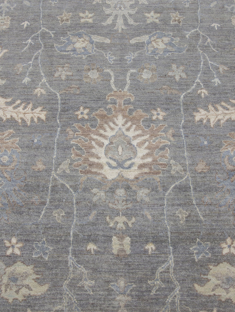 Hand knotted one of a kind 8x10 modern grey turkish oushak wool rug from Pakistan with beige, brown, green tint, ivory and blue accent colors.